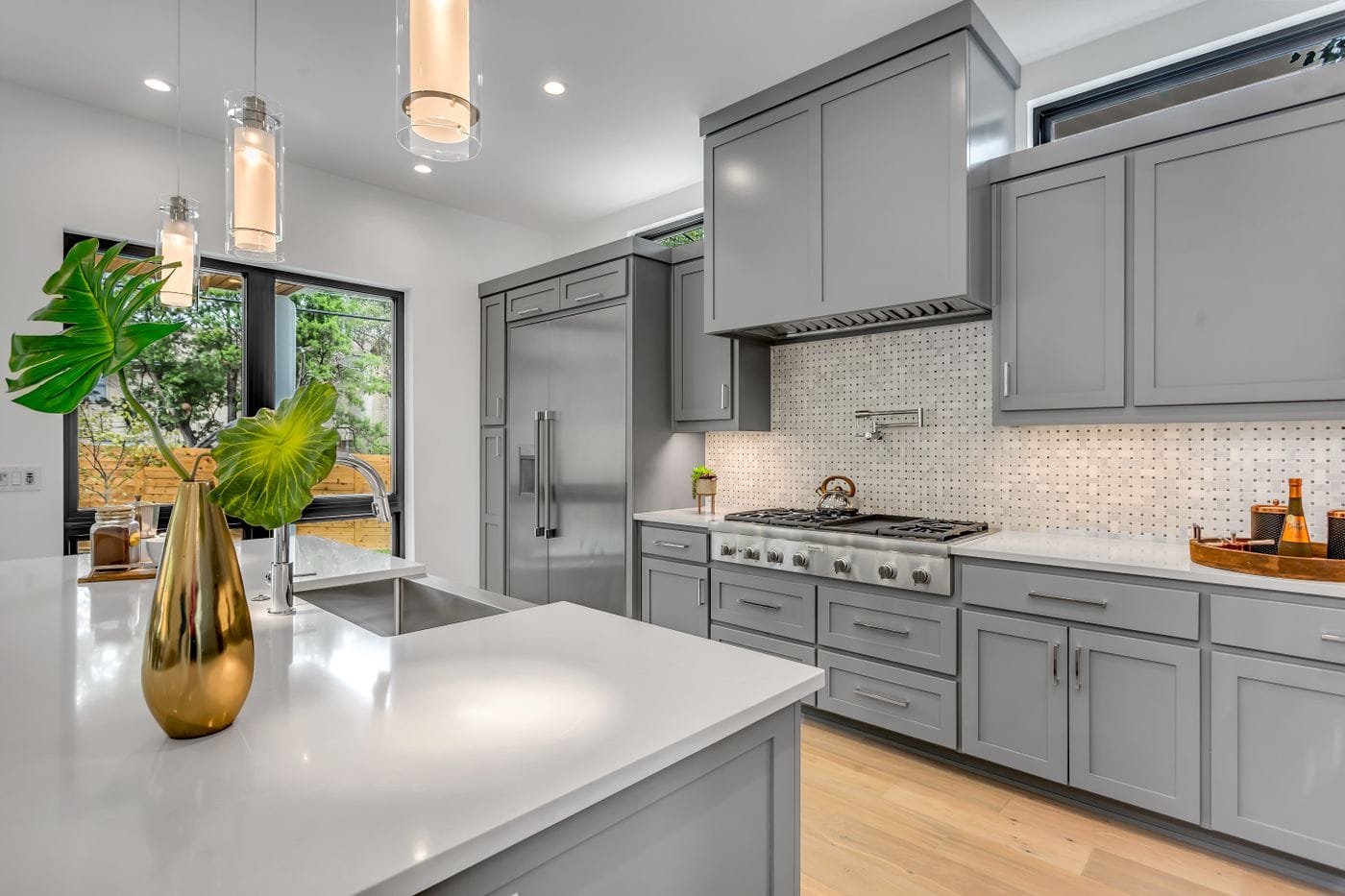 Kitchen cabinets refinished in slate gray with brass hardware in Chester NY