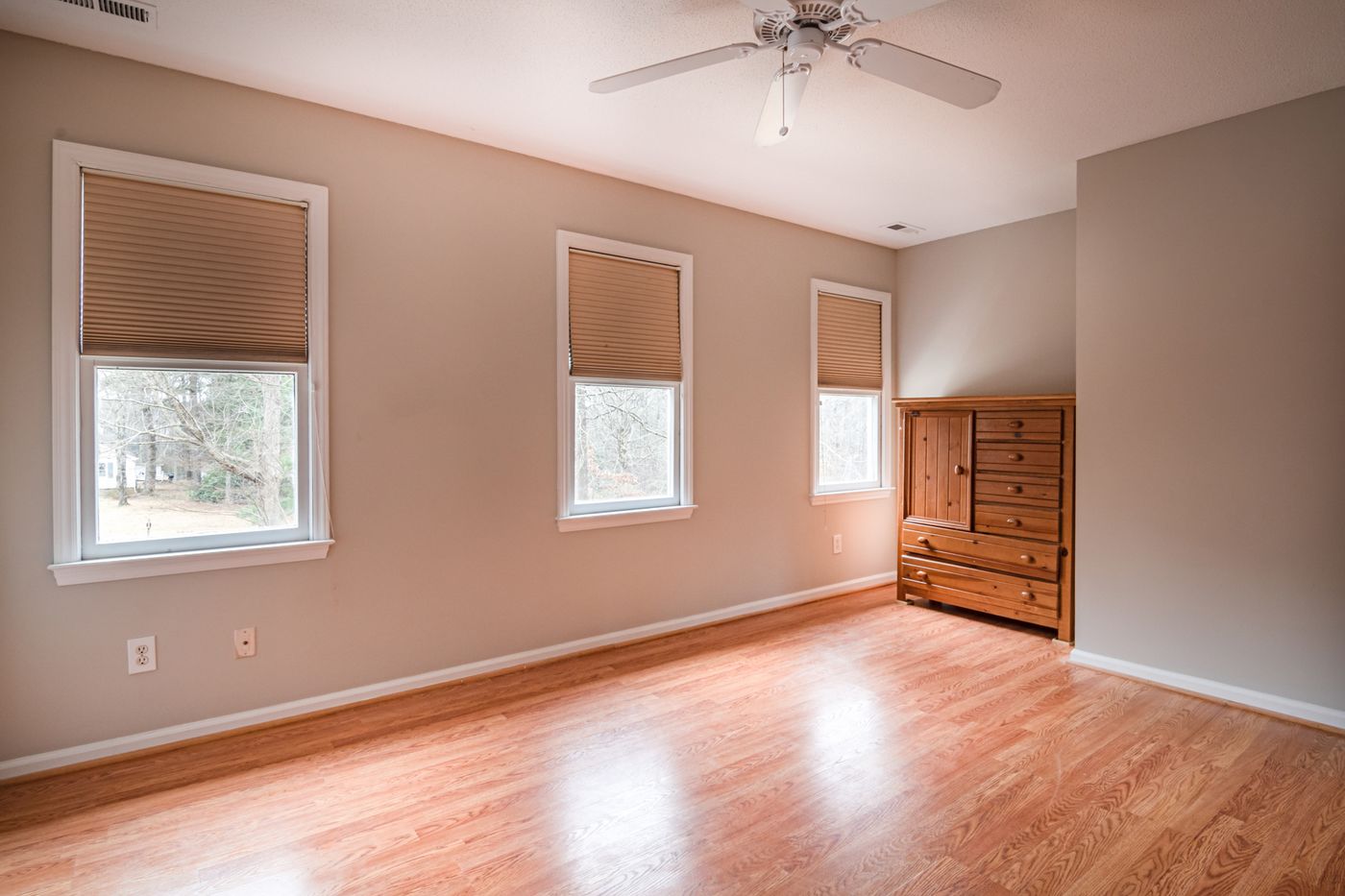 Warm beige bedroom repaint with soft natural light in Goshen NY