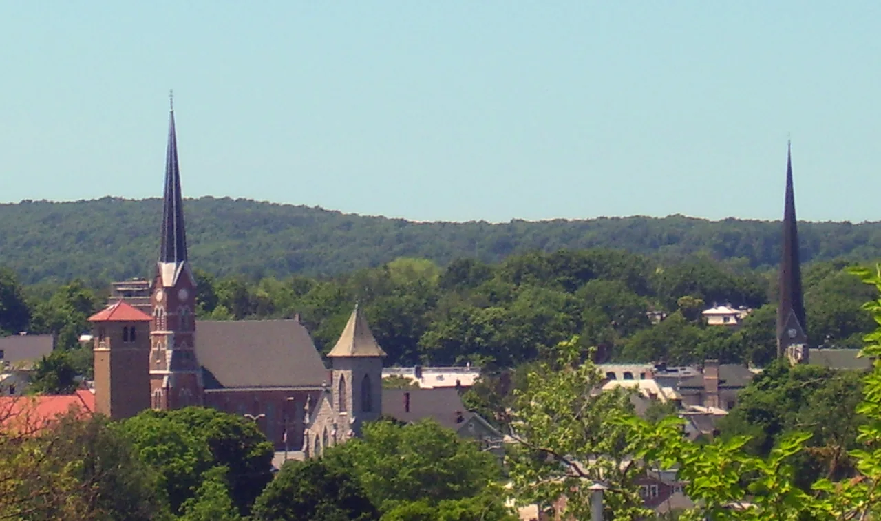 Downtown Middletown church spires above the trees in Orange County, New York